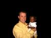 Bro. Eddie holding one of the children